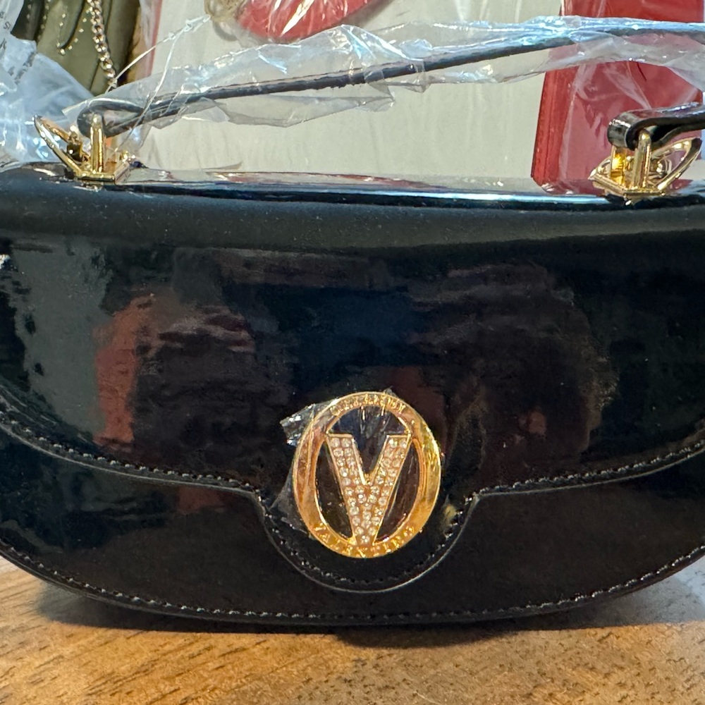Black Patent Leather Valentino Orlandi bag.